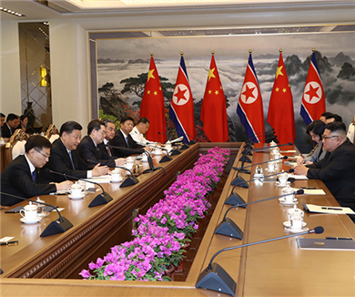 习近平同金正恩举行会谈
