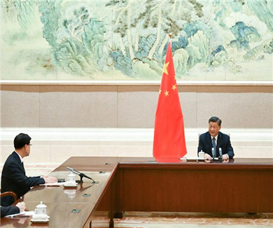 习近平会见李家超
